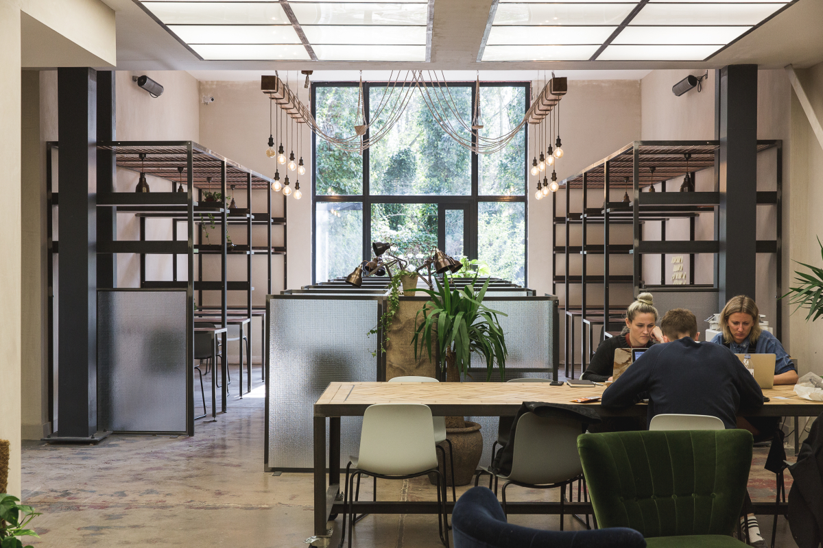 People working at Palm Space co-working space at Hackney Downs Studios