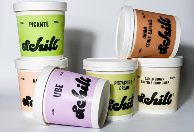 Colourful tubs of & Chill gelato and sorbet in flavours like Ube, Pistachio & Cream, and Unami Stout-Caramel, stacked on display at Netil Market