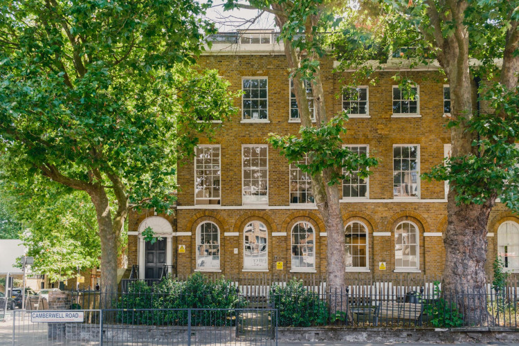 Exterior view of Cornerstone Studios on Camberwell Road, showcasing Georgian architecture, tall sash windows and mature street trees in South London