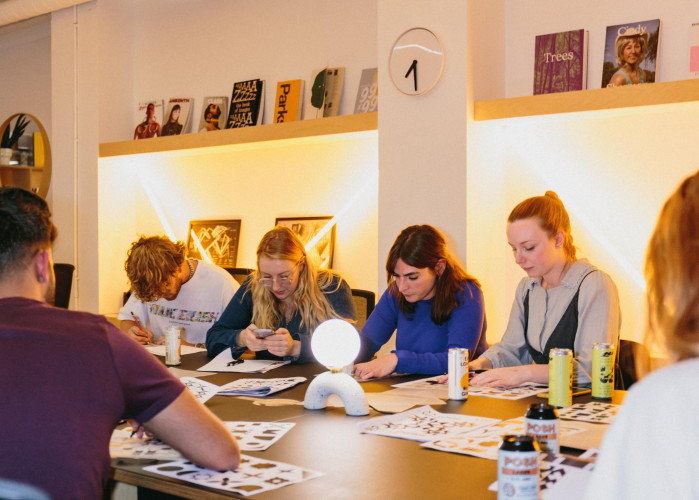 Creative workshop in progress at Sunbury Workshops with residents focused on design and drawing tasks