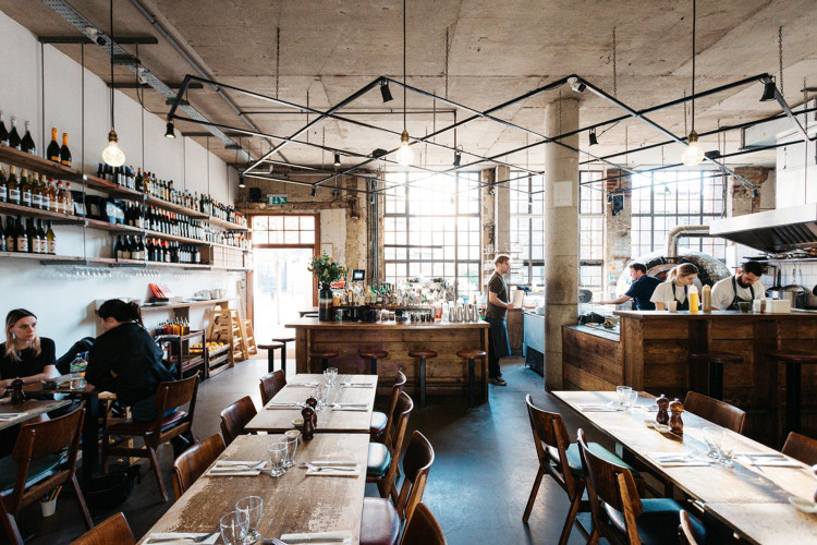 Industrial-style restaurant Lardo in Hackney with open kitchen and rustic furnishings