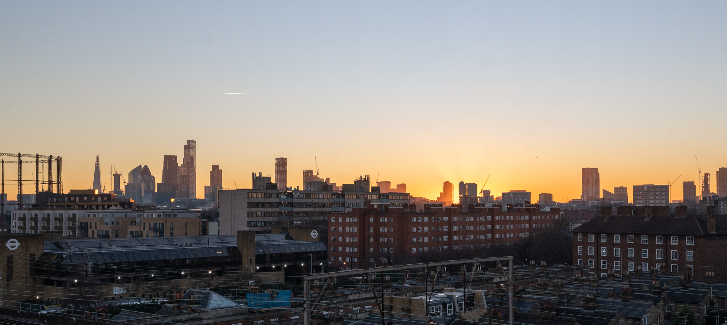 Sunset skyline view of London from Netil Corner in Hackney, showcasing iconic city architecture and Eat Work Art’s East London location