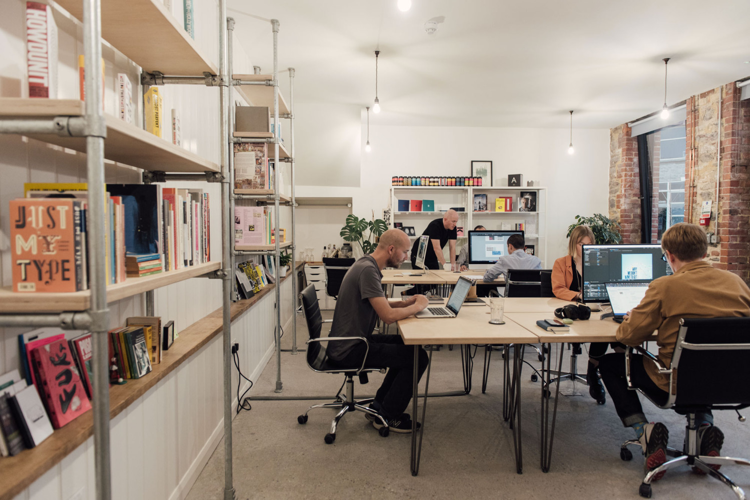 Creative professionals working at shared desks in Alma Yard coworking space, Plymouth