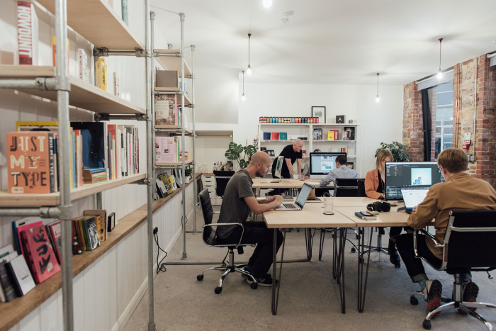 Creative professionals working at shared desks in Alma Yard coworking space, Plymouth