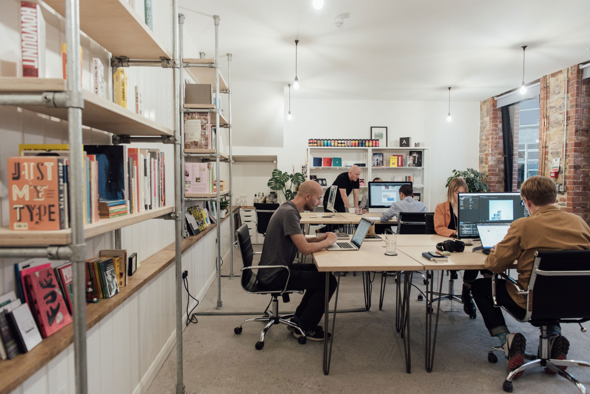 Creative professionals working at shared desks in Alma Yard coworking space, Plymouth