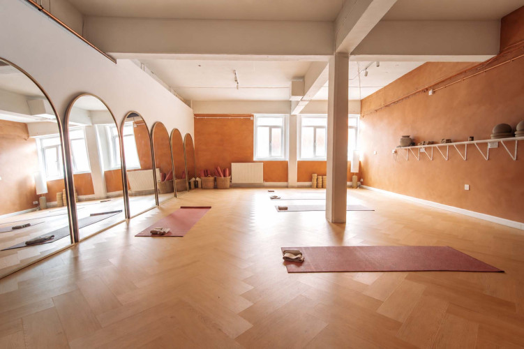 Modern pilates studio at Light Studios Plymouth, featuring Pilates reformer machines, large mirrors and natural light in a serene, minimalist setting